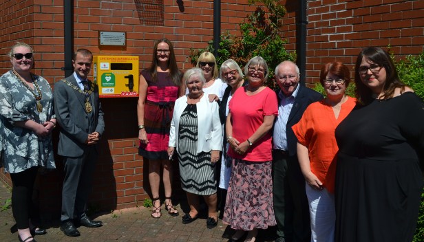 Mayor Mayoress of Trafford with Boundary House Medical Centre Patient Participation Group Renee Watt in front in stripes