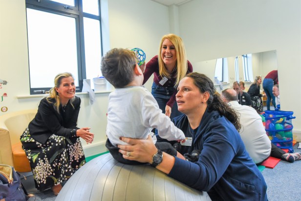 9. HRH watching a Physiotherapy demonstration with Nadia (NW Centre Manager and Paediatric Physiotherapist)