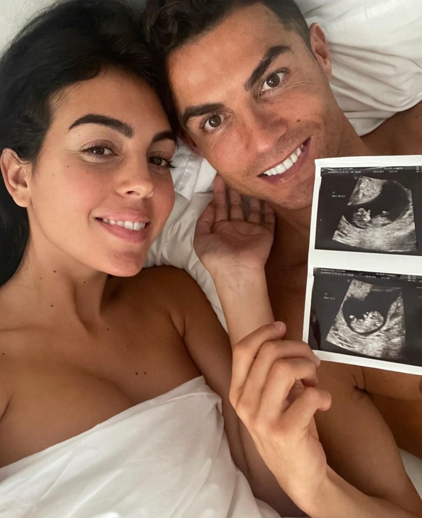 Cristiano and Georgina with pictures of the twins